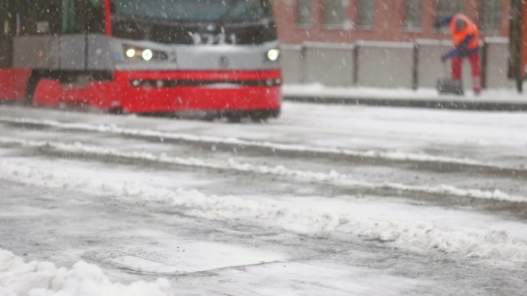Tram Arriving To The Frozen Platform During Storm
