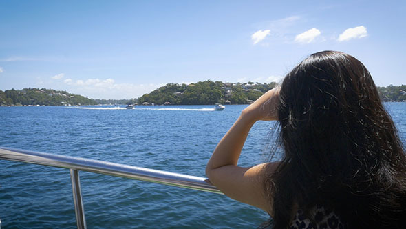 Lady on a Sunny Harbour River Cruise