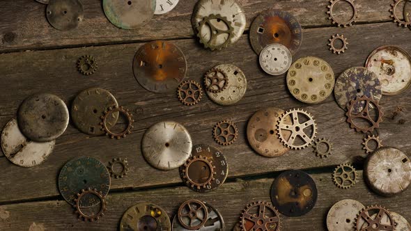 Rotating stock footage shot of antique and weathered watch faces alt