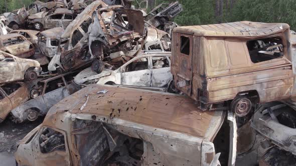 War in Ukraine a Dump of Burned Cars in Irpin Bucha District alt