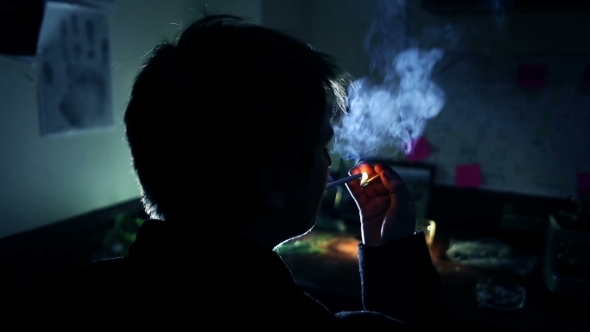 Smoking. A Man Lights a Cigarette.