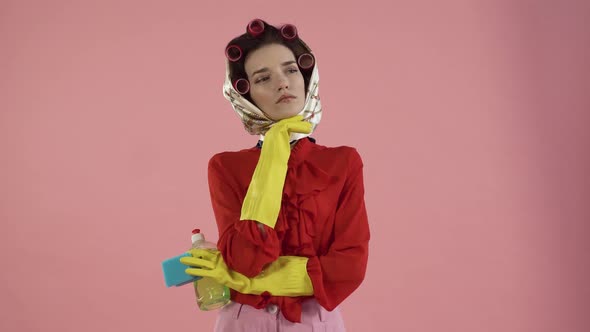 A Young Woman with a Serious Expression Thinks and Looks Away