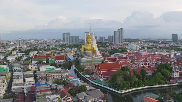 Aerial view of the Giant Golden Buddha in Wat Paknam Phasi Charoen Temple alt