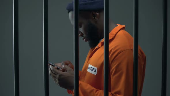 Afro-American Prisoner Using Phone in Cell, Corruption in Prisons, Prohibition alt