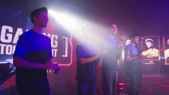Cyber Sportsmen Clapping Hands During Gaming Tournament alt