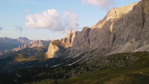 Dolomites, Alp Mountain range, cloud shadow on jagged peaks, breathtaking aerial alt