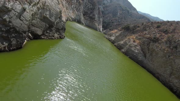 Aerial shot of a reservoir in the San Gabriel Mountains near Los Angles alt