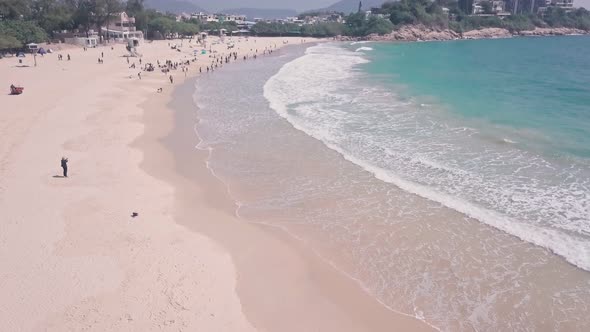 Shek O Beach, a white sandy stretch of sand in Hong Kong Island. Aerial drone view alt