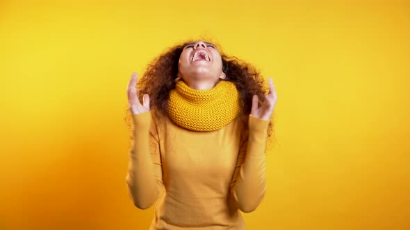 Girl with Curly Hair Very Glad To Hear Happy News, She Shows Yes Gesture alt