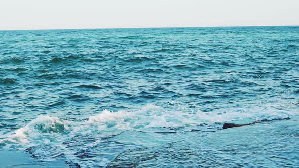 Crests of the Waves are Breaking on the Reefs Near the Shore in the Summer alt