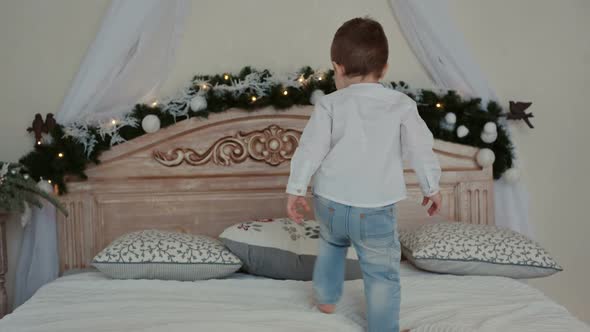 A Young Mother and Her Son Lying on the Bed, Stock Footage | VideoHive