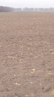 Vertical Video of a Field with Plowed Land in Autumn Slow Motion alt