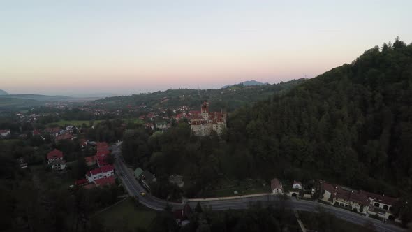 Arial shot of a road near Bran Castle alt
