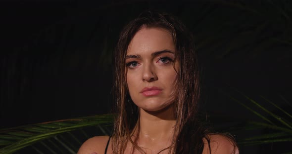 Attractive Young Woman Smiling on a Gray Background. Portrait of a Happy Smiling Girl in the Studio alt