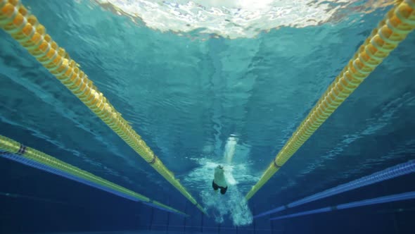Male Swimmer Crawling in Pool