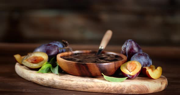 Jam From Plums on a Plate with a Spoon Slowly Rotates.  alt