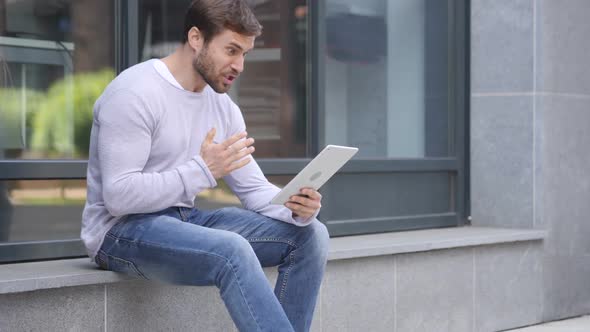 Loss Man Frustrated By Results on Laptop While Sitting on Stairs alt