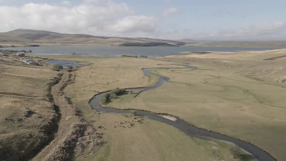 Aerial view of Paravani river floating in Saghamo Lake. Samtskhe-Javakheti, Georgia alt