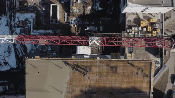 Vertical Shot From Above of a Crane on a Construction Site in Slow Motion in Kharkov, Ukraine. Tall alt