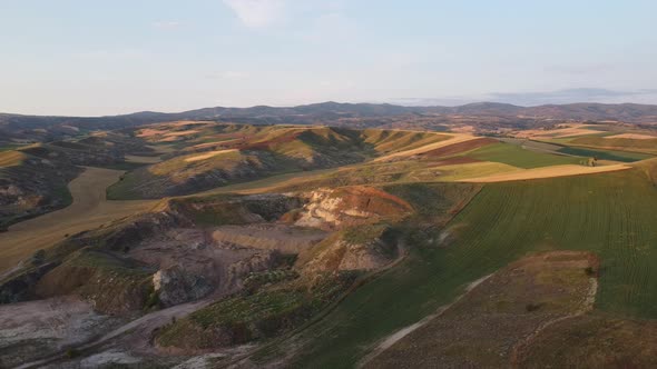 Aerial drone footage of endless fields hills alt