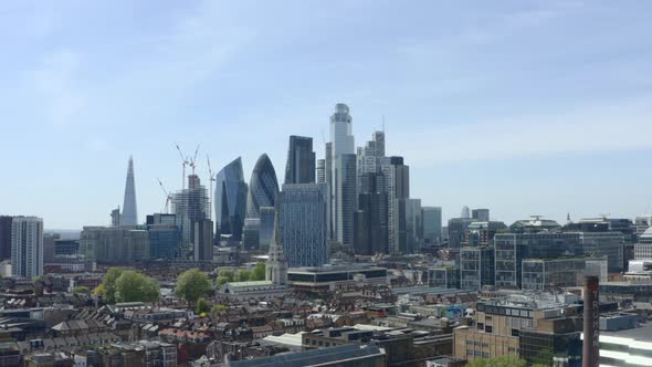 Rising aerial shot of City of London skyscrapers from the east alt
