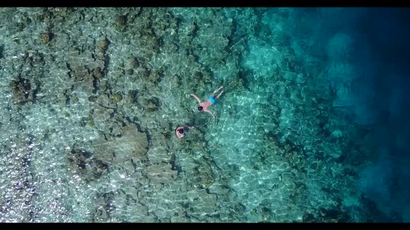 Aerial top view abstract of tranquil coast beach voyage by blue ocean with white sand background of  alt