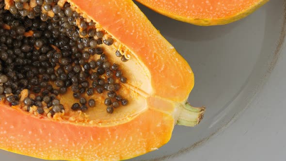 Top View of Ripe Half Cut Papaya, Healthy Summer Food Concept with Tropical Fruits, Flat Lay alt