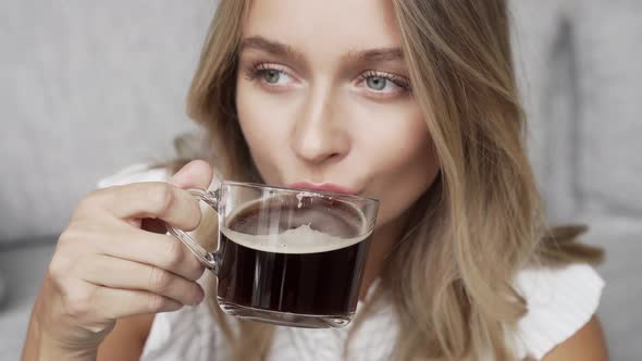 Blond Woman Relaxing With A Coffee