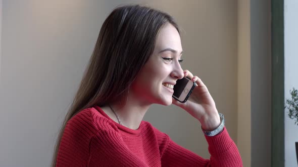 Young Girl Speaks By Phone