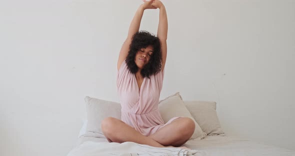 Young Happy Mixed Race Woman Practicing Yoga and Doing Breathing Exercises alt