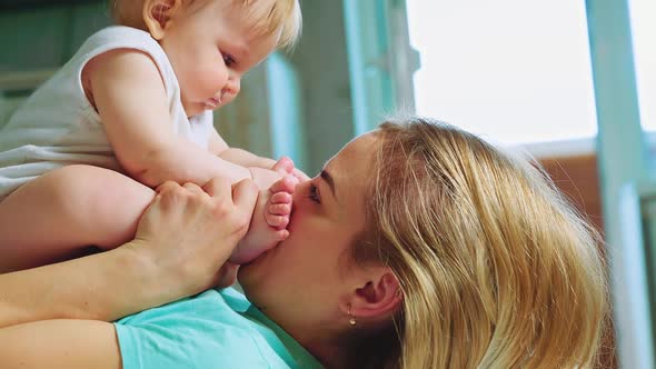 Happy Mother and Her Baby alt