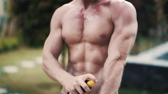 Close Up, Athletic Sexy Man Applies Tanning Oil To His Body alt