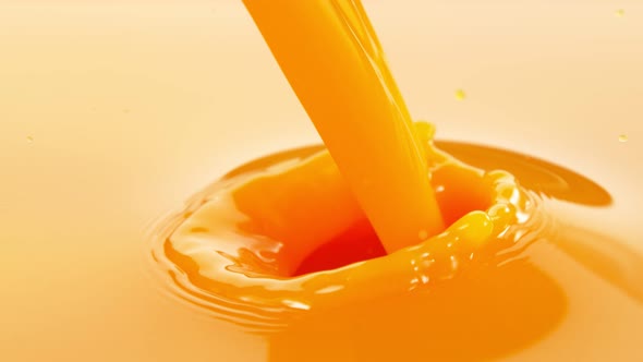 Super Slow Motion Shot of Pouring Fresh Orange Juice at 1000Fps alt