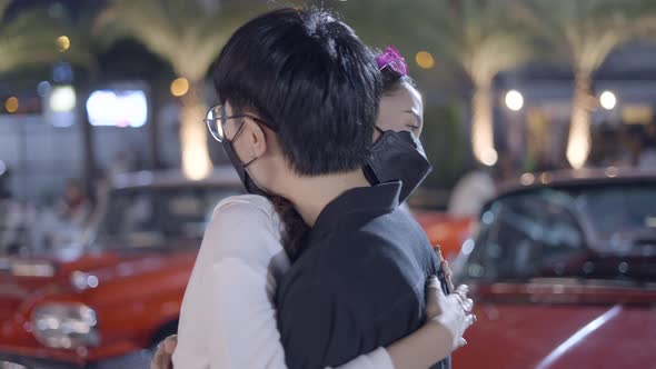 A Couple Was Hugging Each Other on the Street and Sharing Their Love alt