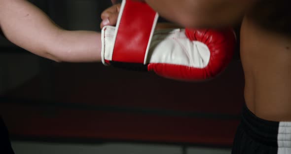 Coach Helps Women Boxer To Put On Gloves 17b