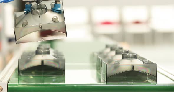 Close Up Of Molded Plastic Materials Released From Injection Molding Machine. alt