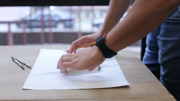 A civil engineer designs and works on drawings and analyzes the structure of a project. alt