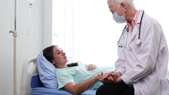 Senior Female doctor checking the symptoms of the woman patient. the concept of health alt