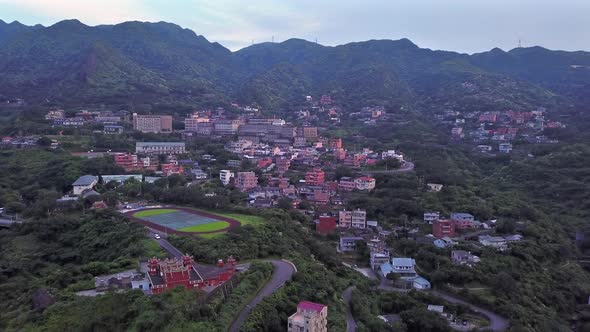 Aerial view of buildings in Jiufen village on mountain hill in Taipei, Taiwan. alt