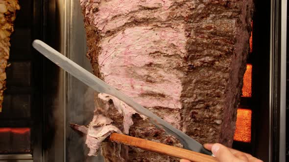 Shawarma Meat Being Cut Before Making Traditional Turkish Doner Kebab in Turkey alt