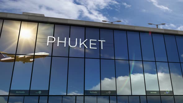 Airplane landing at Phuket Thailand airport mirrored in terminal alt