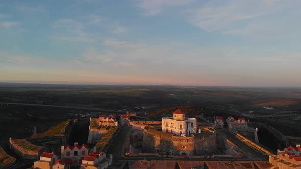 Lowering in the golden light for an aerial view of Fort of Nossa Senhora da Graca. alt