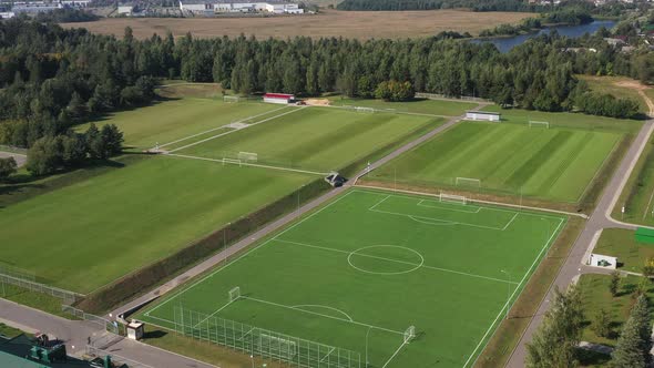 Top View of a Football Field with Green Grass Outdoors in Summer
