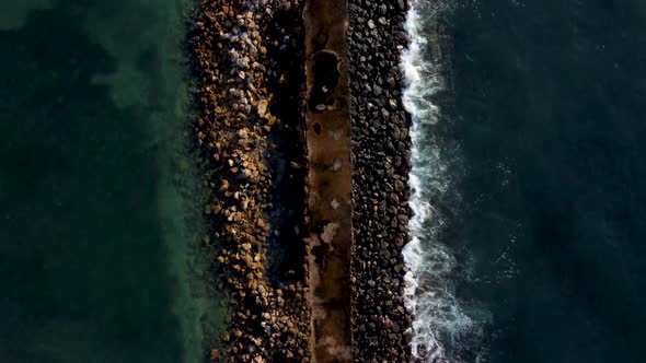 Top Down View on Breakwater a Far From the Beach alt