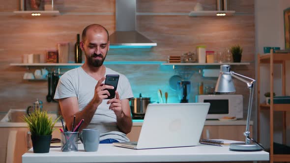 Freelancer Taking Break and Searching on Phone alt