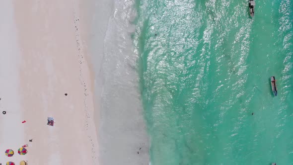 Aerial Top Paradise Beach with Umbrellas and Turquoise Ocean Nungwi Zanzibar alt