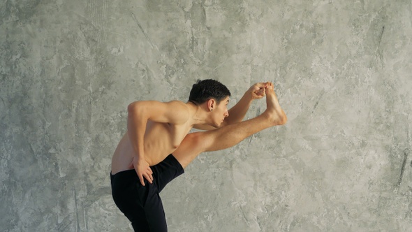 Sportsman doing sport exercise bending in variation of alt