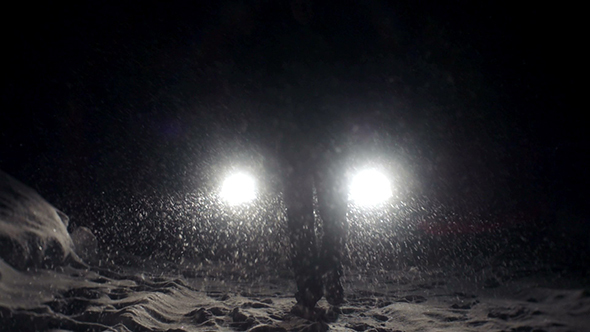 Man Walks In Front Of A Car Headlights 2