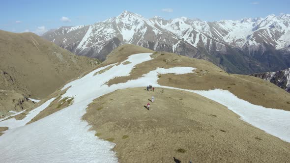 Group of Tourists Walking Along the Ridge of the Khodyuk Pass