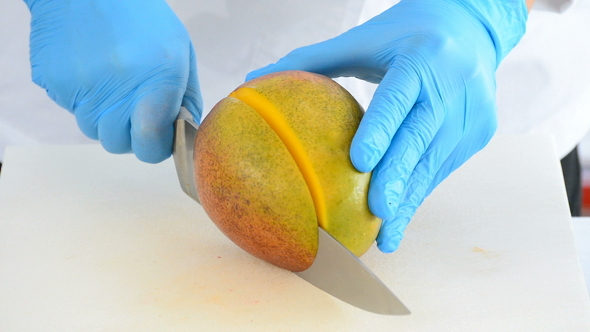 Cutting a Mango Fruit into Small Dices with a Knife, Stock Footage